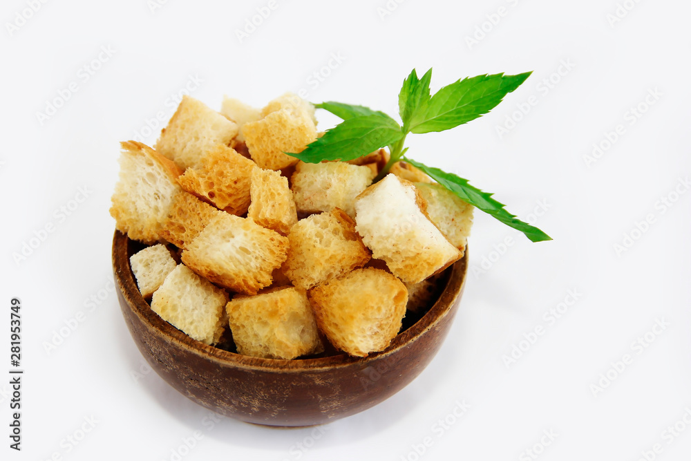 fried white bread croutons with mint leaves in wooden plate fried white bread croutons with mint leaves in wooden plate