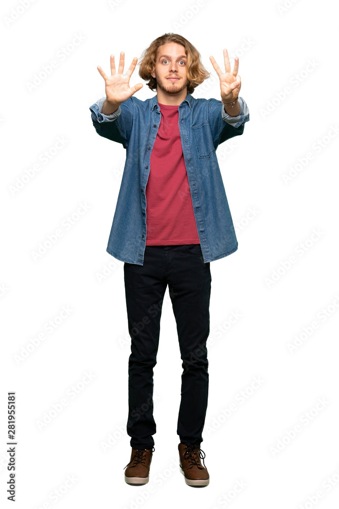 Full-length shot of Blonde man counting eight with fingers over isolated white background Full-length shot of Blonde man counting eight with fingers over isolated white background