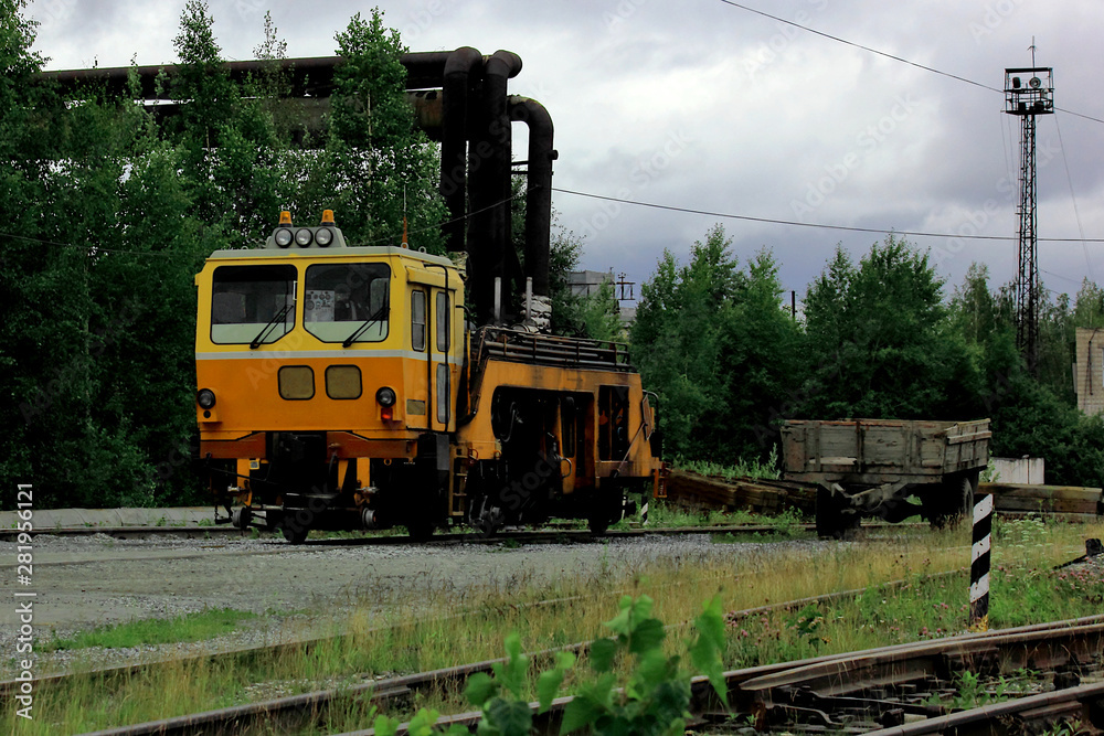 yellow rail car on the railway