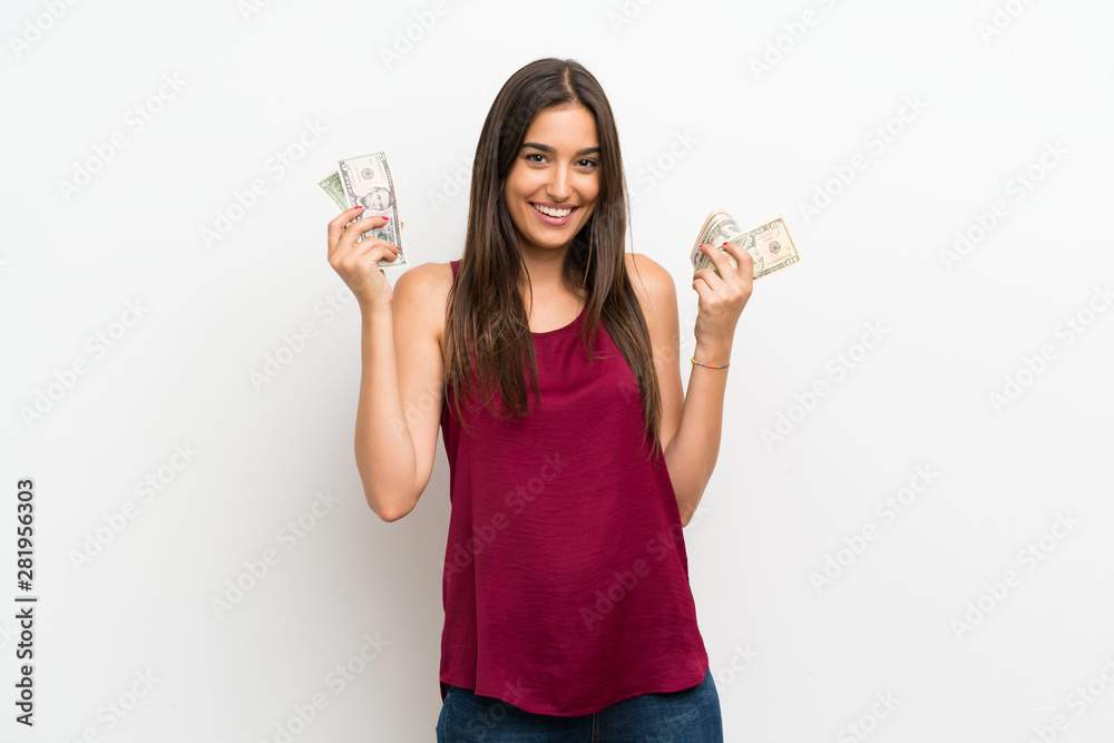 Young woman over isolated white background taking a lot of money Young woman over isolated white background taking a lot of money