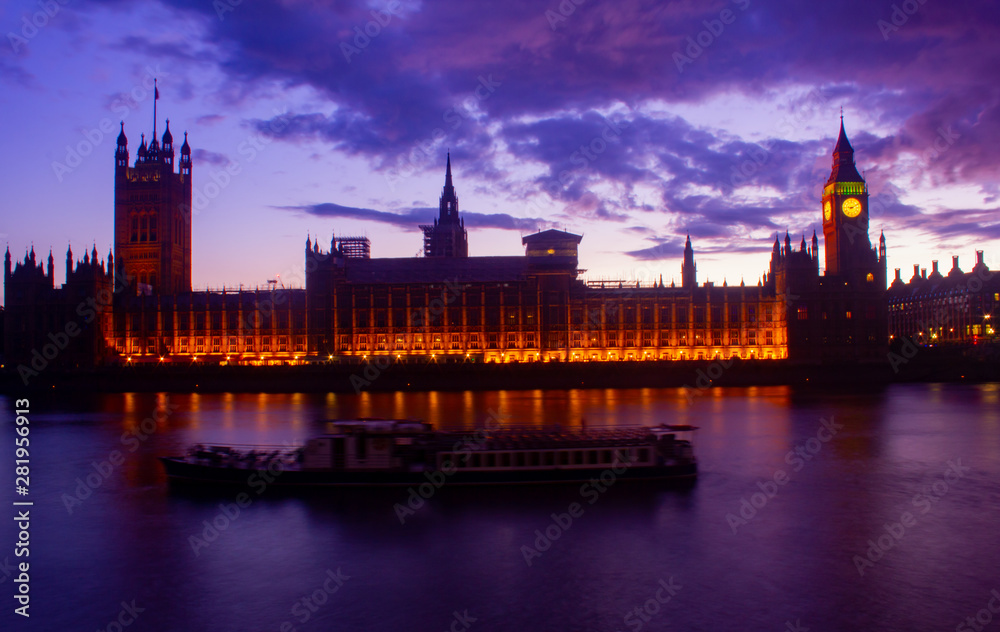 Glowing British Parliament Westminster Big Ban at Sunset in London United Kingdom