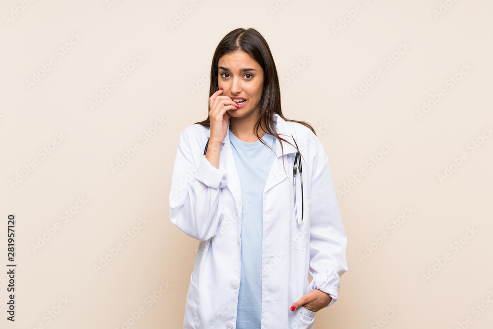 Young doctor woman over isolated background nervous and scared Young doctor woman over isolated background nervous and scared
