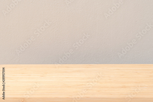 Wood desk tabletop texture isolated on concrete wall background