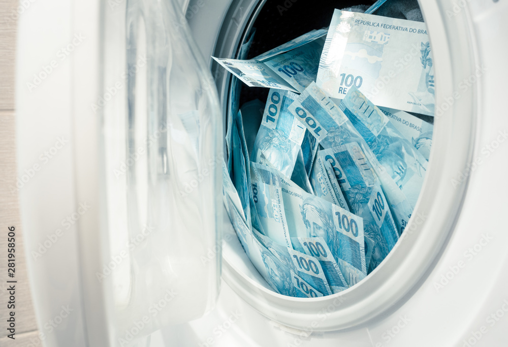 Brazilian money, hundreds of reais in the washing machine. The concept of money laundering, corruption Brazilian money, hundreds of reais in the washing machine. The concept of money laundering, corruption