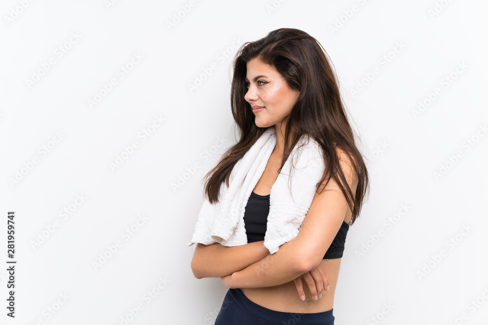 Teenager sport girl over isolated white background standing and looking to the side Teenager sport girl over isolated white background standing and looking to the side