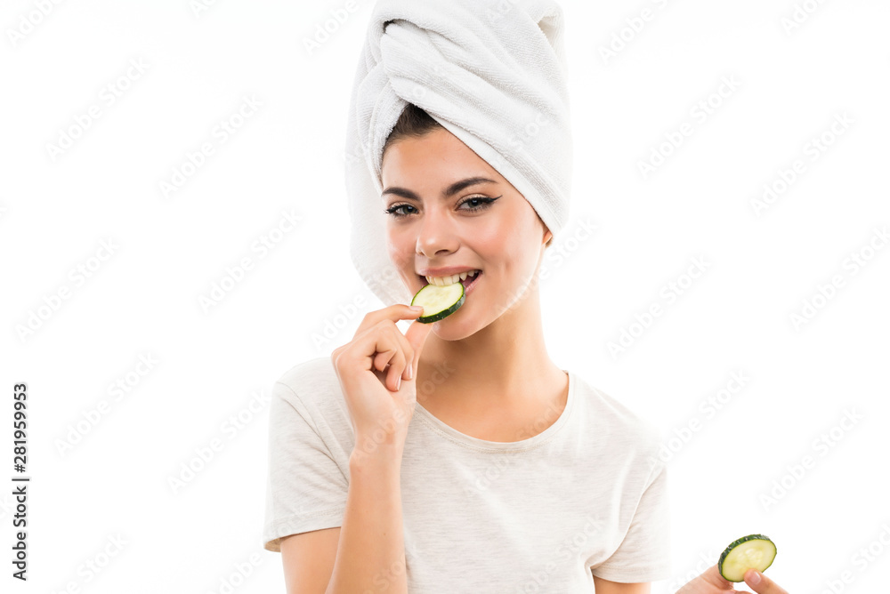 Beautiful young woman holding slices of cucumber. Beautiful young woman holding slices of cucumber.