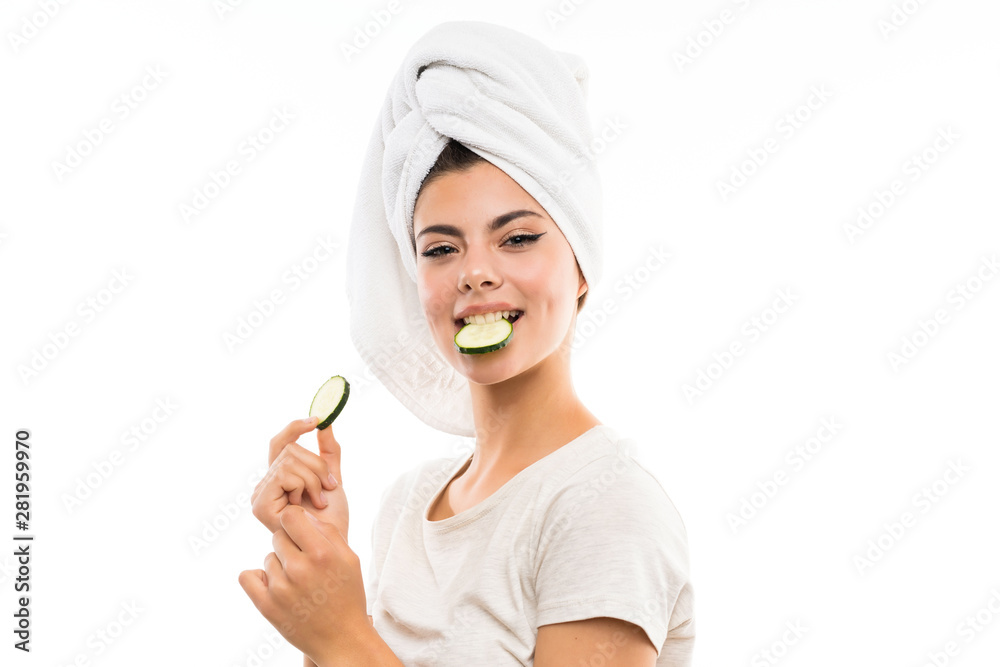 Beautiful young woman holding slices of cucumber. Beautiful young woman holding slices of cucumber.