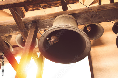 Leinwand Poster vintage church bell under tower old christian church in Thailand.