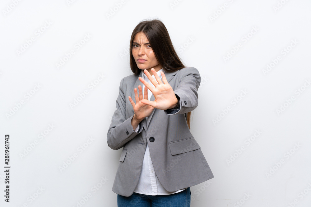 Young business woman over isolated white background nervous stretching hands to the front Young business woman over isolated white background nervous stretching hands to the front