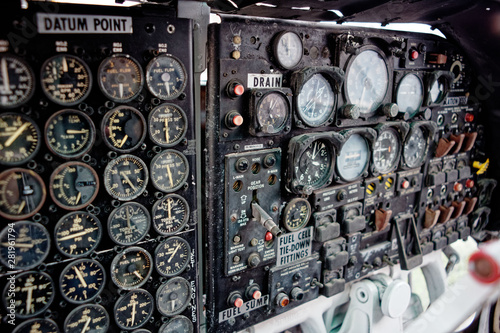 old vintage aircraft cockpit detail, pattern of multi meter gauge measure background