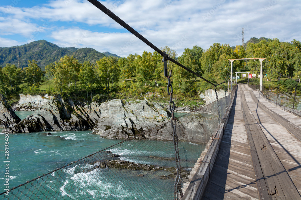 Fototapeta premium Suspension bridge over the Katun river in the village of Elekmonar