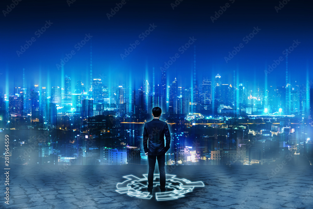 Business man standing on future network city