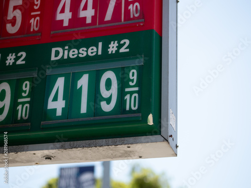 Gas station sign with prices displayed with diesel and premium fuel