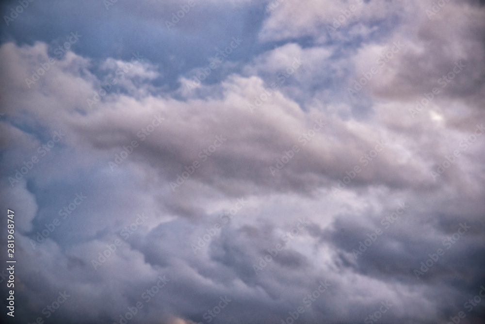Dark heavy clouds after the rain has formed a divine gap of light and sun. Dark heavy clouds after the rain has formed a divine gap of light and sun.