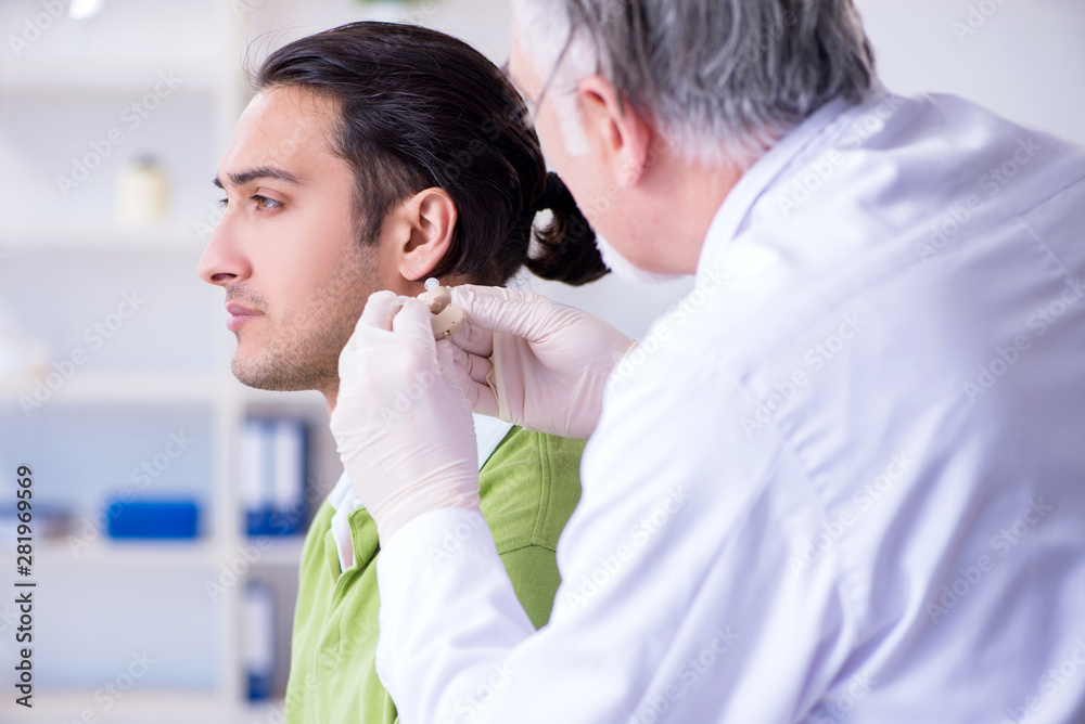 Male patient with hearing problem visiting doctor otorhinolaryng Male patient with hearing problem visiting doctor otorhinolaryng