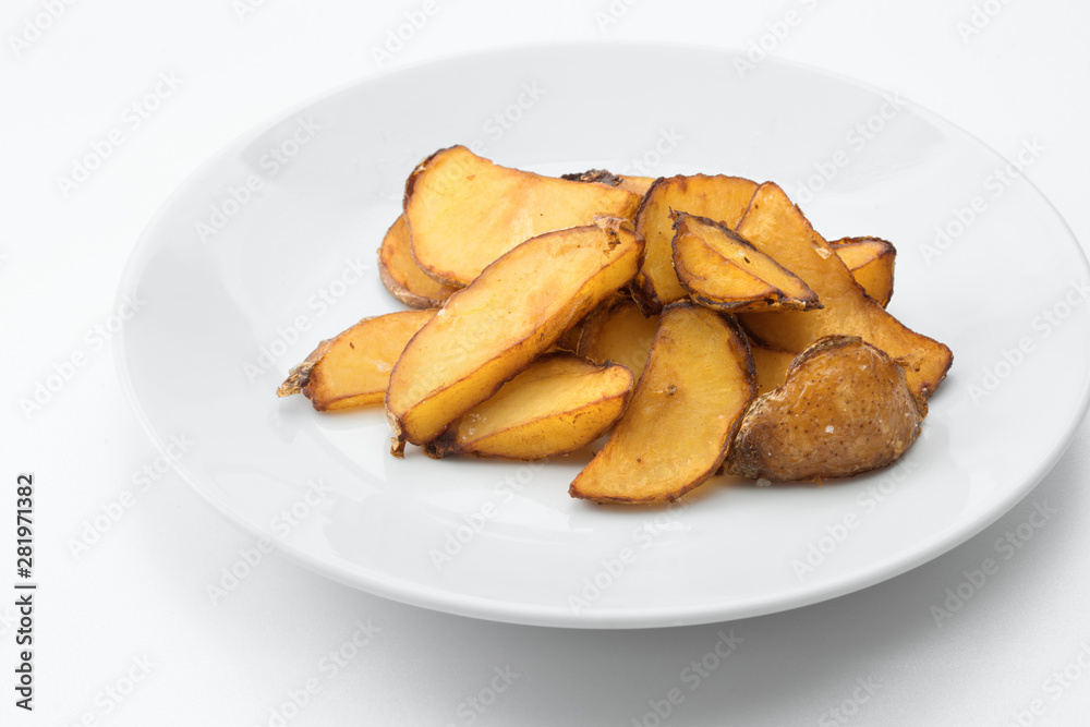 close up view of nice yummy baked potatoes on white back close up view of nice yummy baked potatoes on white back