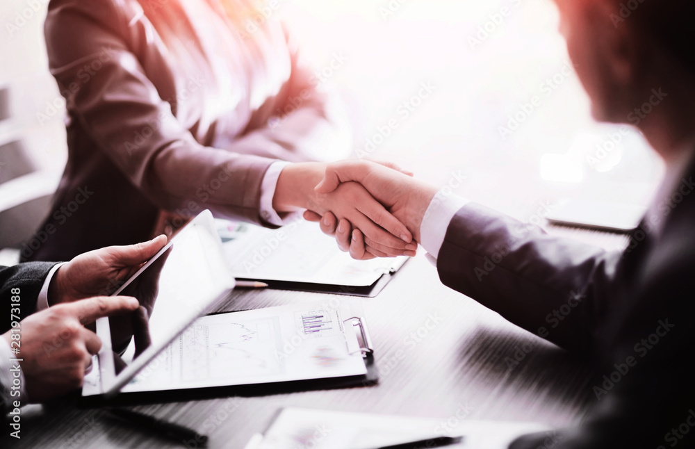 Business people shaking hands, finishing up meeting