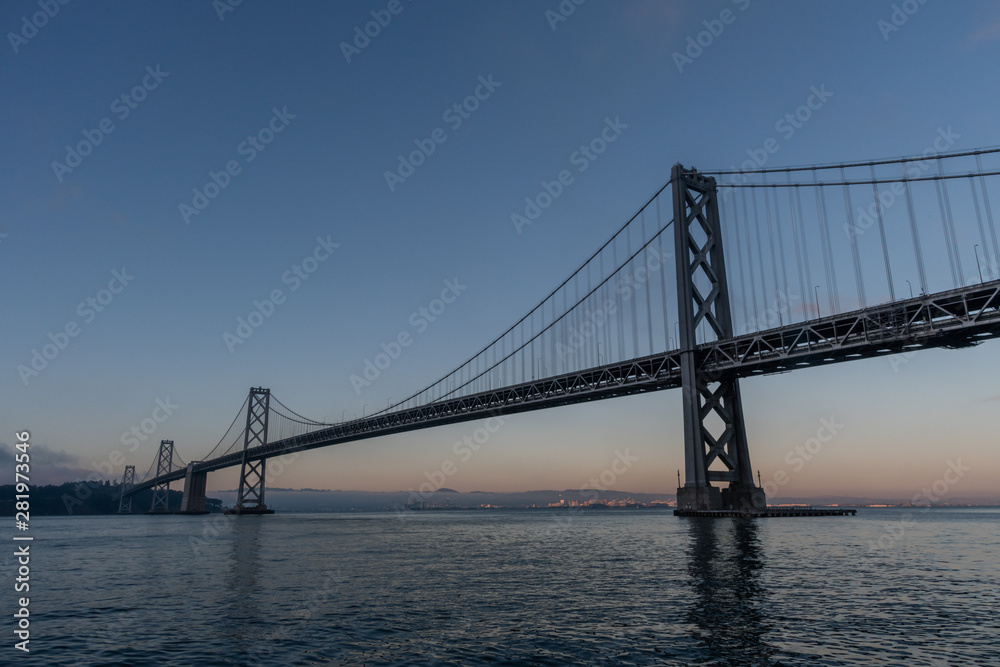 Majestic Bay Bridge vista in San Francisco at dusk, Northern California