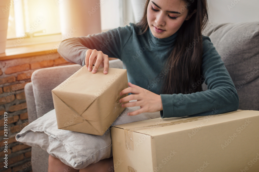 SME startup. asian young entrepreneur woman working and packing cardboard parcel box for send order to customer at home office, shopping online, small business owner, logistics and delivery concept SME startup. asian young entrepreneur woman working and packing cardboard parcel box for send order to customer at home office, shopping online, small business owner, logistics and delivery concept