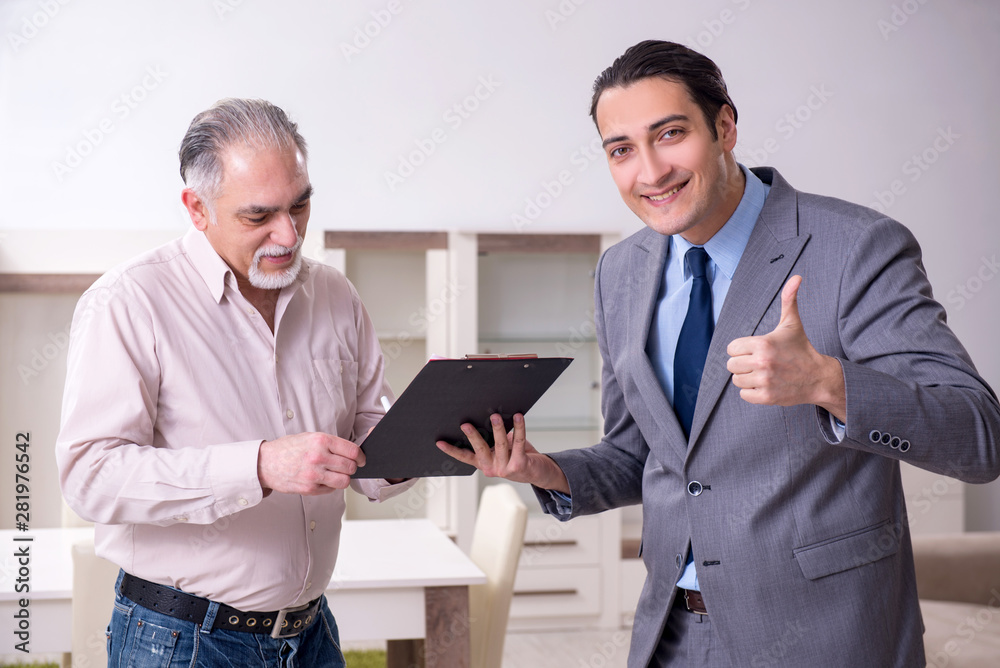 Male real estate agent and male client in the apartment Male real estate agent and male client in the apartment