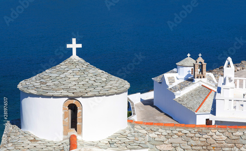 Church and monastery of Evangelistria, the Virgin Mary and Panagitsa Tower on Skopelos, Northen Sporades, Greece © Zzvet