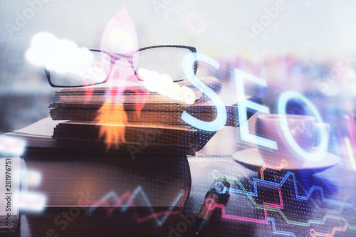 Wallpaper Mural SEO hologram with glasses on the table background. Concept of search engine optimization. Double exposure. Torontodigital.ca