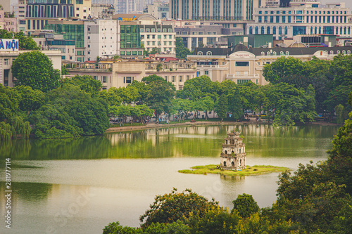 OLD QUARTER, HANOI/VIETNAM City and top view of The Huc bridge and Ngoc Son temple in Lake of the Returned Sword, Hoan Kiem Lake, Turtle Tower. Cities with haze problems.