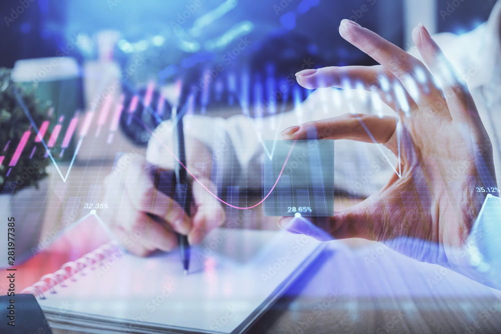 Forex chart displayed on woman's hand taking notes background. Concept of research. Multi exposure Forex chart displayed on woman's hand taking notes background. Concept of research. Multi exposure
