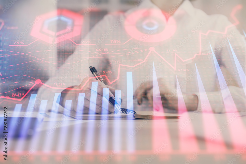 Financial chart drawn over hands taking notes background. Concept of research. Multi exposure Financial chart drawn over hands taking notes background. Concept of research. Multi exposure