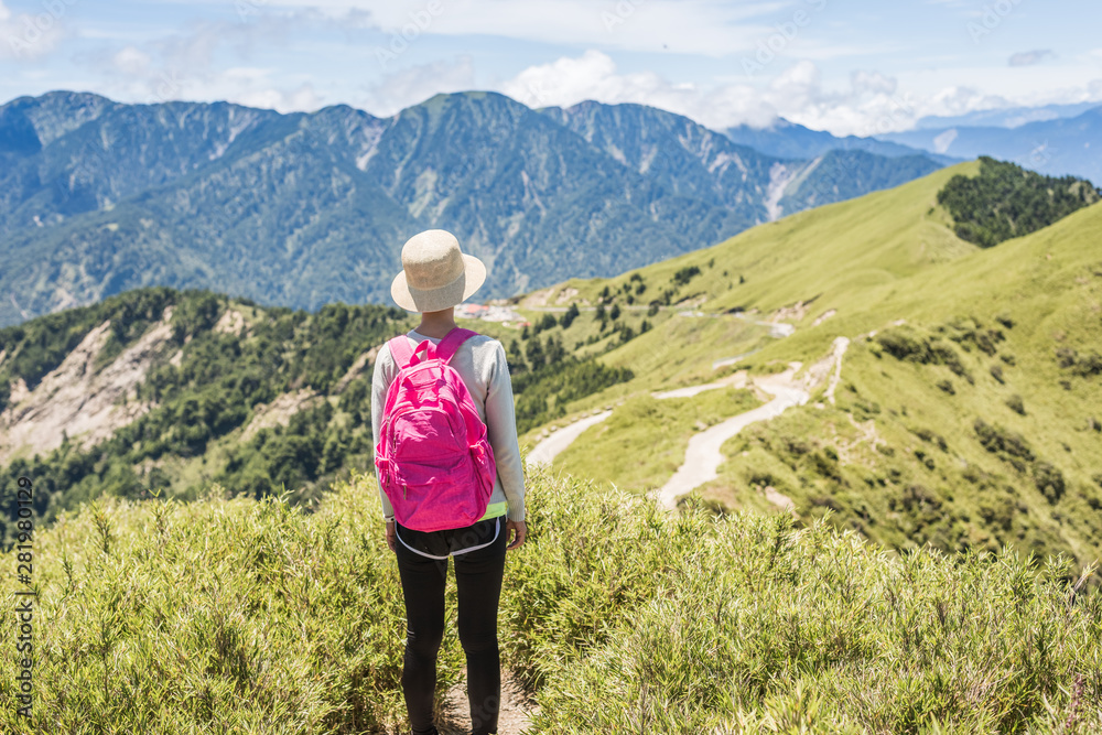 Asian climbing woman look far away