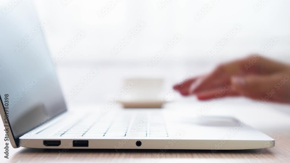 Woman freelancer working on laptop at home-office. Close up of female hands opening and closing computer with one hand. Businesswoman writing business letter at work. Dolly shot of typing on keyboard Woman freelancer working on laptop at home-office. Close up of female hands opening and closing computer with one hand. Businesswoman writing business letter at work. Dolly shot of typing on keyboard