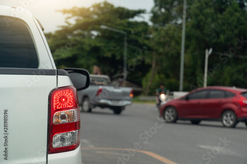Brake of white pick up car on asphalt roads during rush hours for travel or business work. © thongchainak