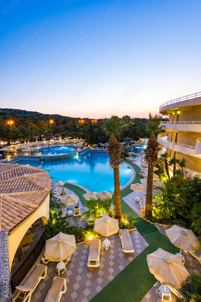 Luxury Hotel Resort with Swimming Poll Illuminated at Sunrise
