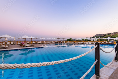 Luxury Swimming Pool at Sunrise in Hotel Resort, Rhodes, Greece © marcin jucha
