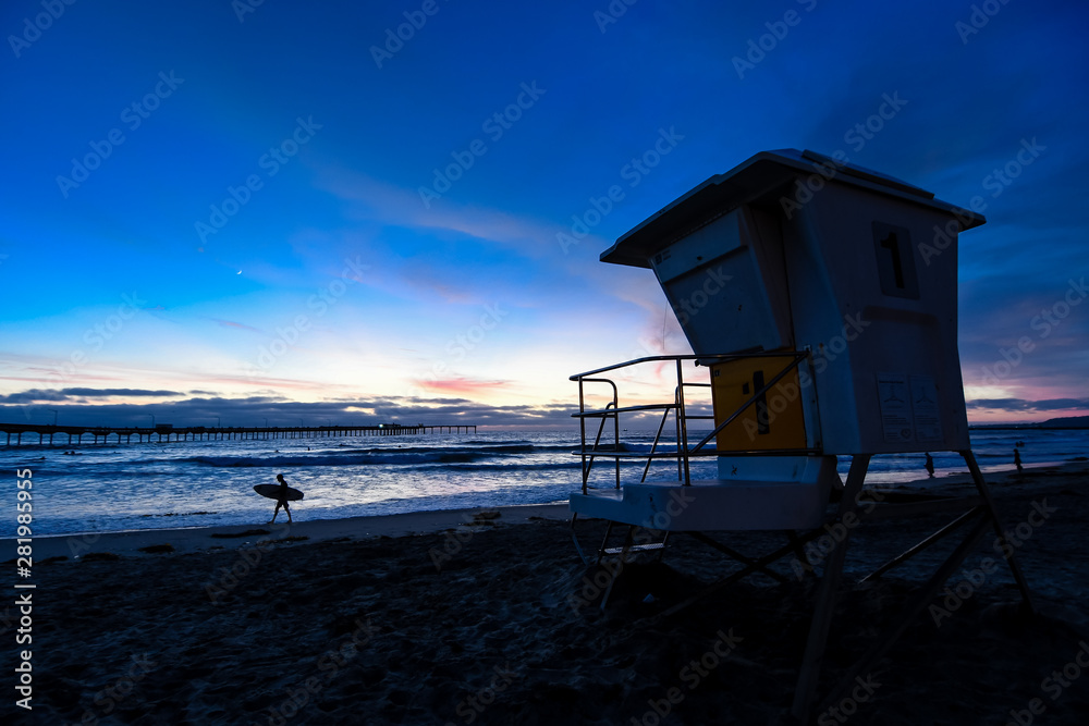 Silhouette of a Surfer at Sunset at Ocean Beach in San Diego California, USA Silhouette of a Surfer at Sunset at Ocean Beach in San Diego California, USA