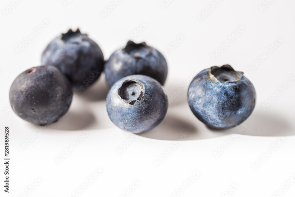 Many red and white berry.Good tasting blueberries with full of healthy vitamins..A good vegan meal. Set of tasty blueberries on white background, closeup. Many red and white berry.Good tasting blueberries with full of healthy vitamins..A good vegan meal. Set of tasty blueberries on white background, closeup.