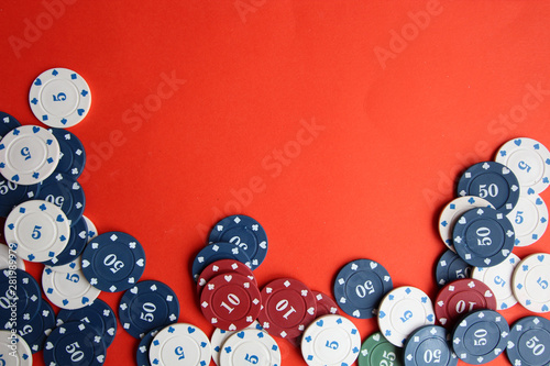 poker cards, pocker chips, money, pocker dice on red background. gambling, board games photo