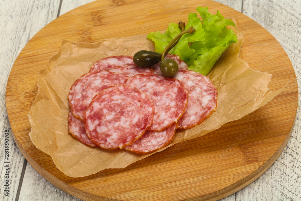 Spanish Salchichon sausage with salad Spanish Salchichon sausage with salad