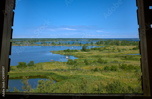 Summer landscape from wooden window in FInland, Mustasaari.