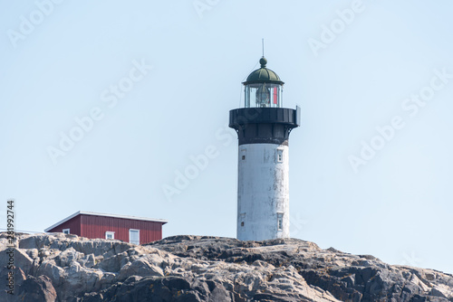 Ursholmen, Sweden - July 26, 2019: View of the lighthouse of the island Ursholmen on the Swedish west coast. photo