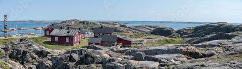 Ursholmen, Sweden - July 26, 2019: View of the red houses on Ursholmen Island in the Swedish Kosterhavet National Park in western Sweden. photo