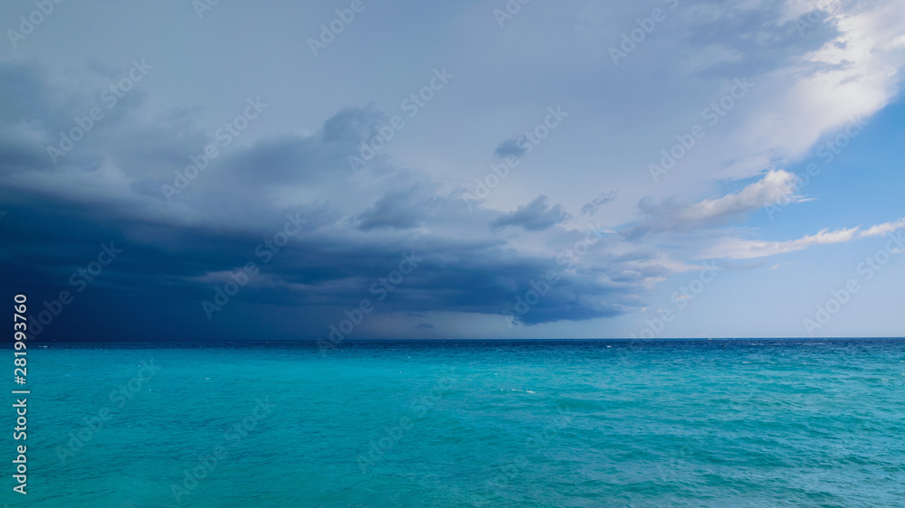 A storm coming over the sea to the left dark clouds on the right more blue sky, French Riviera