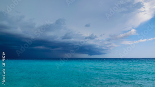 A storm coming over the sea to the left dark clouds on the right more blue sky, French Riviera
