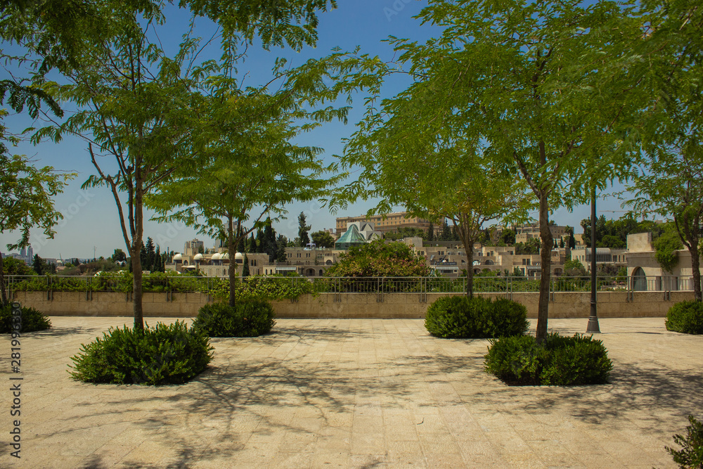 Jerusalem city landscape and landmark photography of park square green trees and building background in summer sunny colorful weather Jerusalem city landscape and landmark photography of park square green trees and building background in summer sunny colorful weather