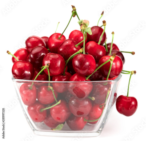 Ripe red cherries in bowl on white. Background isolated