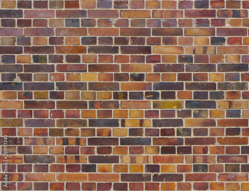 Texture of an old, weathered and colorful brick wall