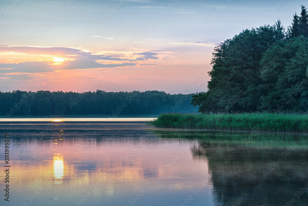 Sunrise over  Szarek Lake. Masuria. Poland.