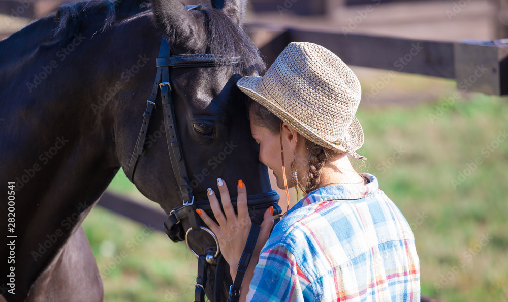 Fototapeta premium Woman and horse. Close up