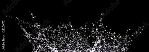 Splashes and drops of water on a black background. Abstract or background image, selective focus. Banner