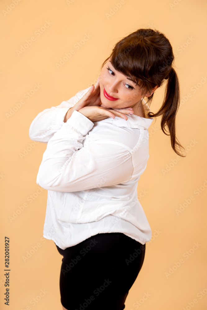 portrait of smiling brunette in white sweater portrait of smiling brunette in white sweater